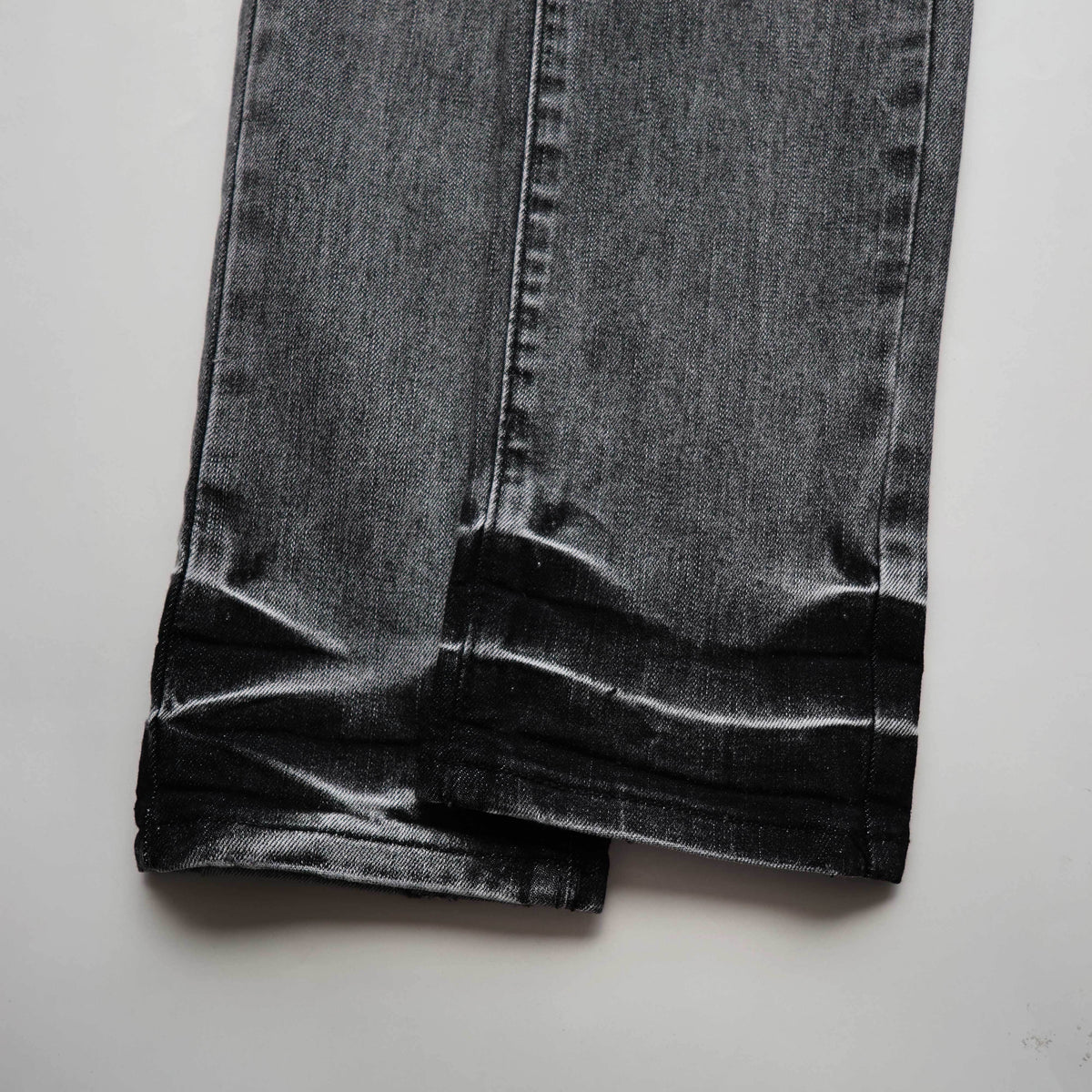 TEXTURED ARCH DENIM “Oil Spill Hem”