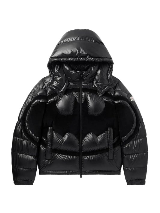 A black puffer jacket with a Batman-inspired bat-shaped quilted design on the front, featuring a hood and a front zipper, shown against a plain white background.